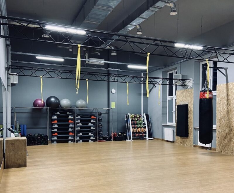 Fitness room with wall steppers, accessories and TRX bands.